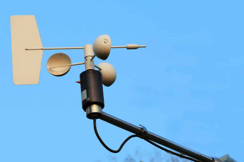 An anemometer and wind vane mounted on the same pole