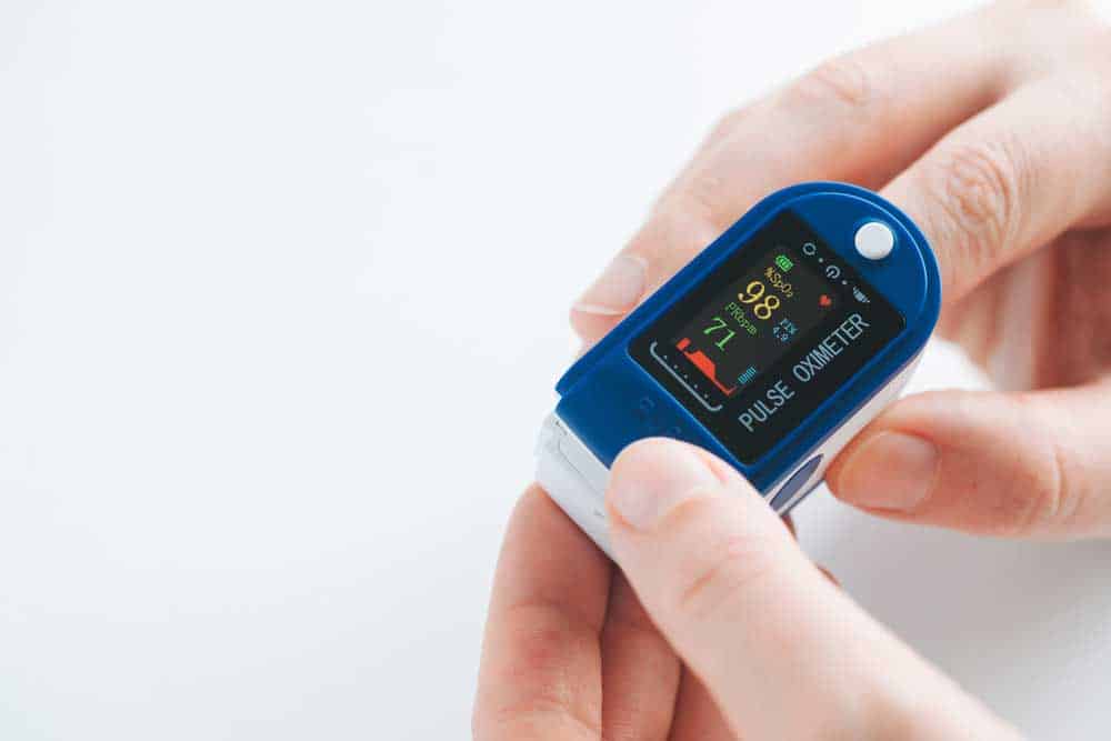 A pulse oximeter (note the oxygen saturation and pulse rate readings)